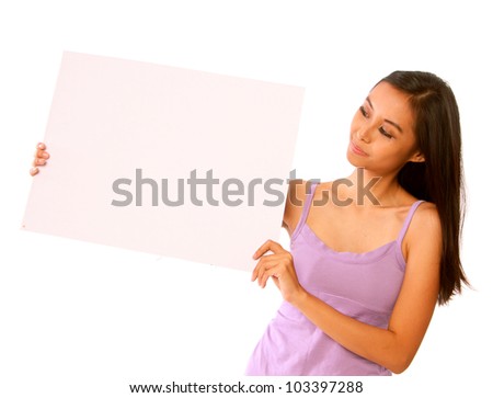 Young Happy Intelligent Caucasian / Asian Woman Holding Up a Blank White Placard / Board. Isolated on White Background. With Copy Space for Text / Logo