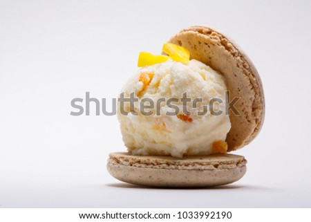 Vanilla ice cream and macaroon set on plate Royalty-Free Stock Photo #1033992190