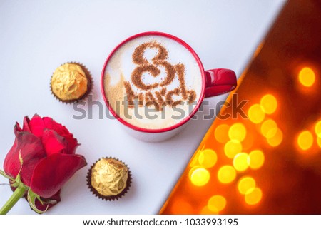 Cappuccino in red mug with congratulations on women's day by March 8