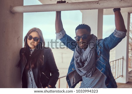 Portrait of an attractive stylish couple. African-American guy w