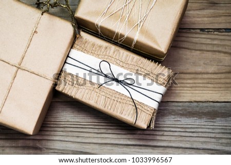 Gift box handmade from white paper, dry twigs, spruce. New Year Christmas.