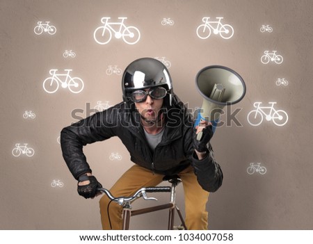 Young ridiculous biker with line drawn bikes on the background