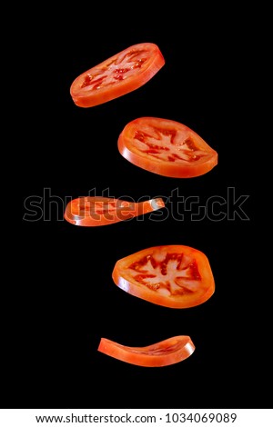5 Flying tomato slices Royalty-Free Stock Photo #1034069089