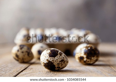 quail eggs on wooden table.