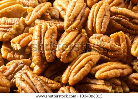 Pecans nuts. A close-up photograph. Unrefined whole kernel