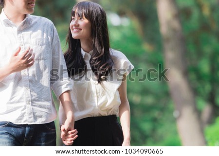 Japanese couples walk the road Royalty-Free Stock Photo #1034090665