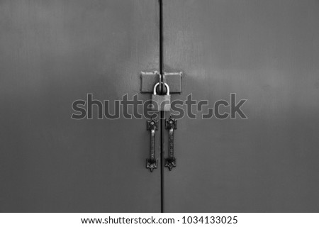 Lock on brown metal door, Old lock on the door vintage style.
