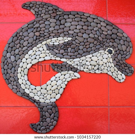 Dolphin from natural pebbles
