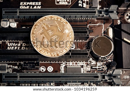 Bitcoin. New virtual money. Bitcoins lie on the video card, concept of mining.
