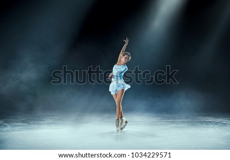 girl figure skating at ice arena