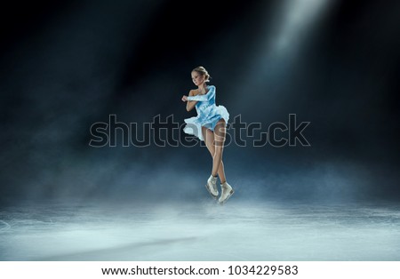 girl figure skating at ice arena