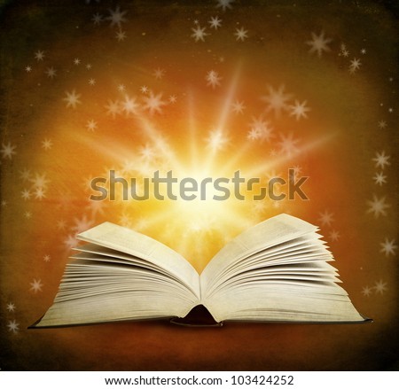 Open magic book on a background and lights
