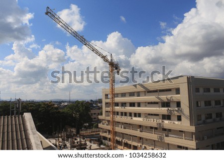 Construction site with cranes on sky background.Crane is working on buildings.selective focus.
