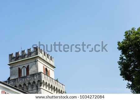 castle tower with tree and blue sky
