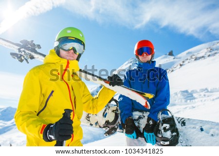 Picture of sports men with skis and snowboard in winter