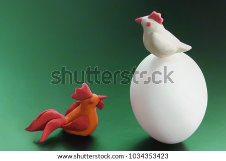 Chicken egg and plasticine chicken toys.