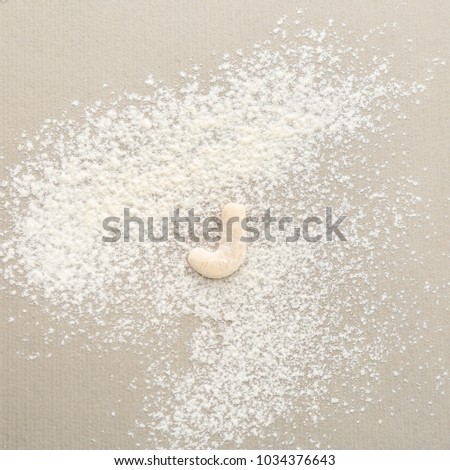 Letter J made of raw dough on flour