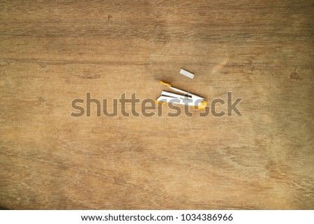 Staples on wood background