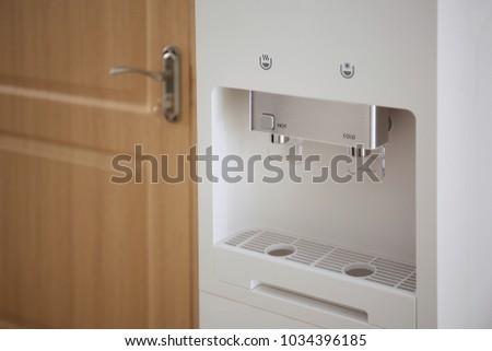 Modern water cooler near door