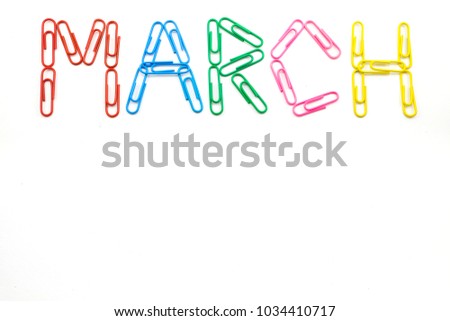 March month, word made from colorful paper clips on white background