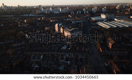 Aerial Drone image of Battersea, in South West London, England on a sunny day.  Image contains many residential buildings.