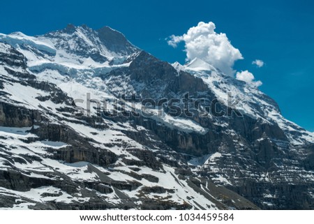 Spectacular view of the mountain Jungfrau and the four thousand meter peaks in the Bernese Alps from Greendeltwald valley, Switzerland Royalty-Free Stock Photo #1034459584