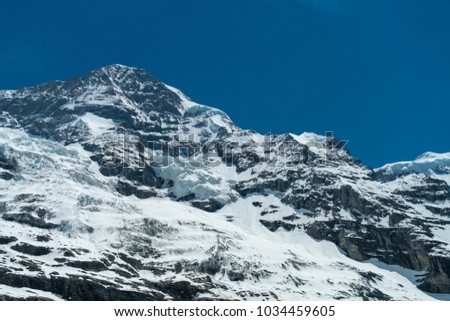 Spectacular view of the mountain Jungfrau and the four thousand meter peaks in the Bernese Alps from Greendeltwald valley, Switzerland Royalty-Free Stock Photo #1034459605