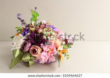 artificial flower bouquet on gray background