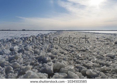 riverbed in the ice of a frozen river