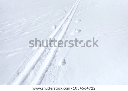 Ski Track. Footprints in the snow. Winter frozen park, lake, river. Concept - healthy lifestyle, skiing