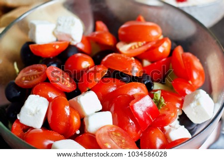 salad of fresh cherry tomatoes, olives and tofu cheese Royalty-Free Stock Photo #1034586028