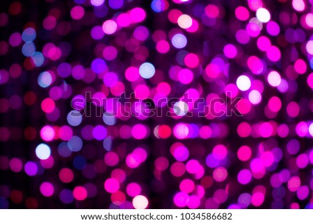 Design pattern of pink lights on black background bokeh effect