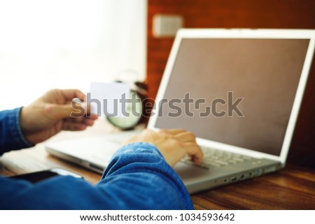 a business man using card for payment online