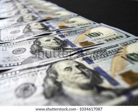USD 100 dollars, many standing on a black background USD dollars