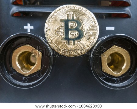 Bitcoin with coins on computer board and copy space using as background technology, money finance, business concept.