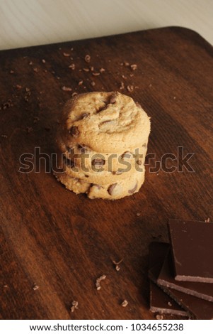 cookies with chocolate on a wooden background