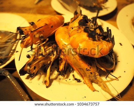 Grilled shrimp in white plate, close up food