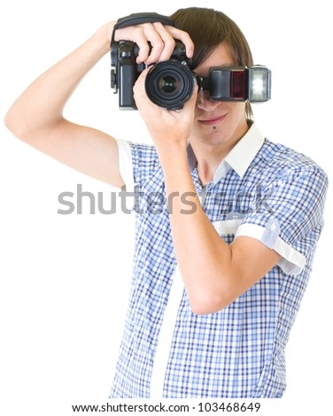 Young man photographer doing photos by digital camera