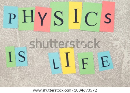 Physics is life on a light stone background, close up, top view