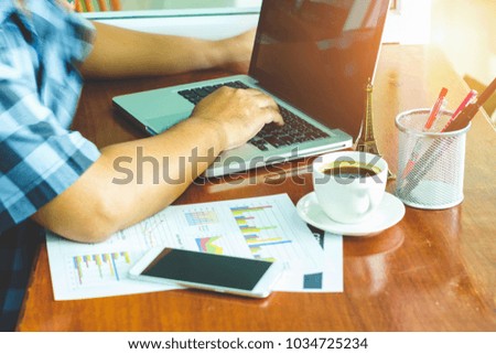 Business men sit in front of a laptop computer on the desk with professionalism in working with modern laptops with Internet technology that will make them successful. 