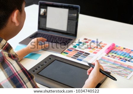 Closeup graphic designer working creative with laptop and mouse pen on artist workplace.
