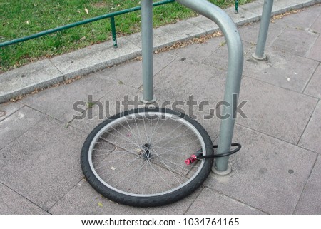        A stolen bicycle and only a wheel with a lock.                        