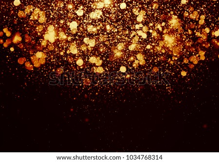 Gold bokeh isolated on black background