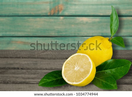 Sliced lemon with green leaf