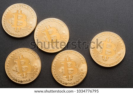 Few bitcoins on a black background and an empty space on the right.