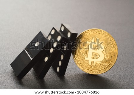 Falling dominoes and coin bitcoin. Abstract image of technology blockchain.