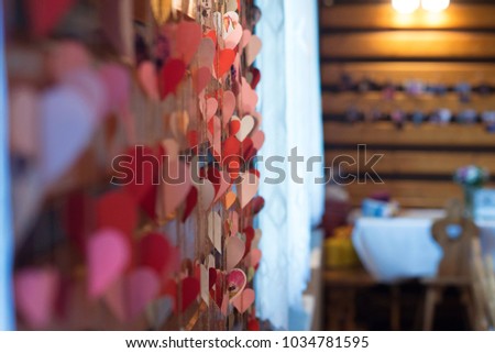 wooden hearts hanging on the wall as a decoration