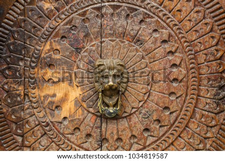 Traditional wooden carving on the door of building in Vashisht village in Kullu valley, Himachal Pradesh, India