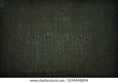Old dark green ancient dirty canvas texture as background