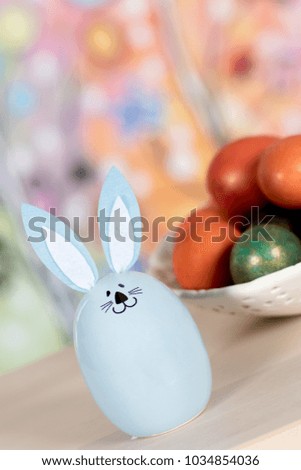 Easter decoration with rabbit and painted eggs